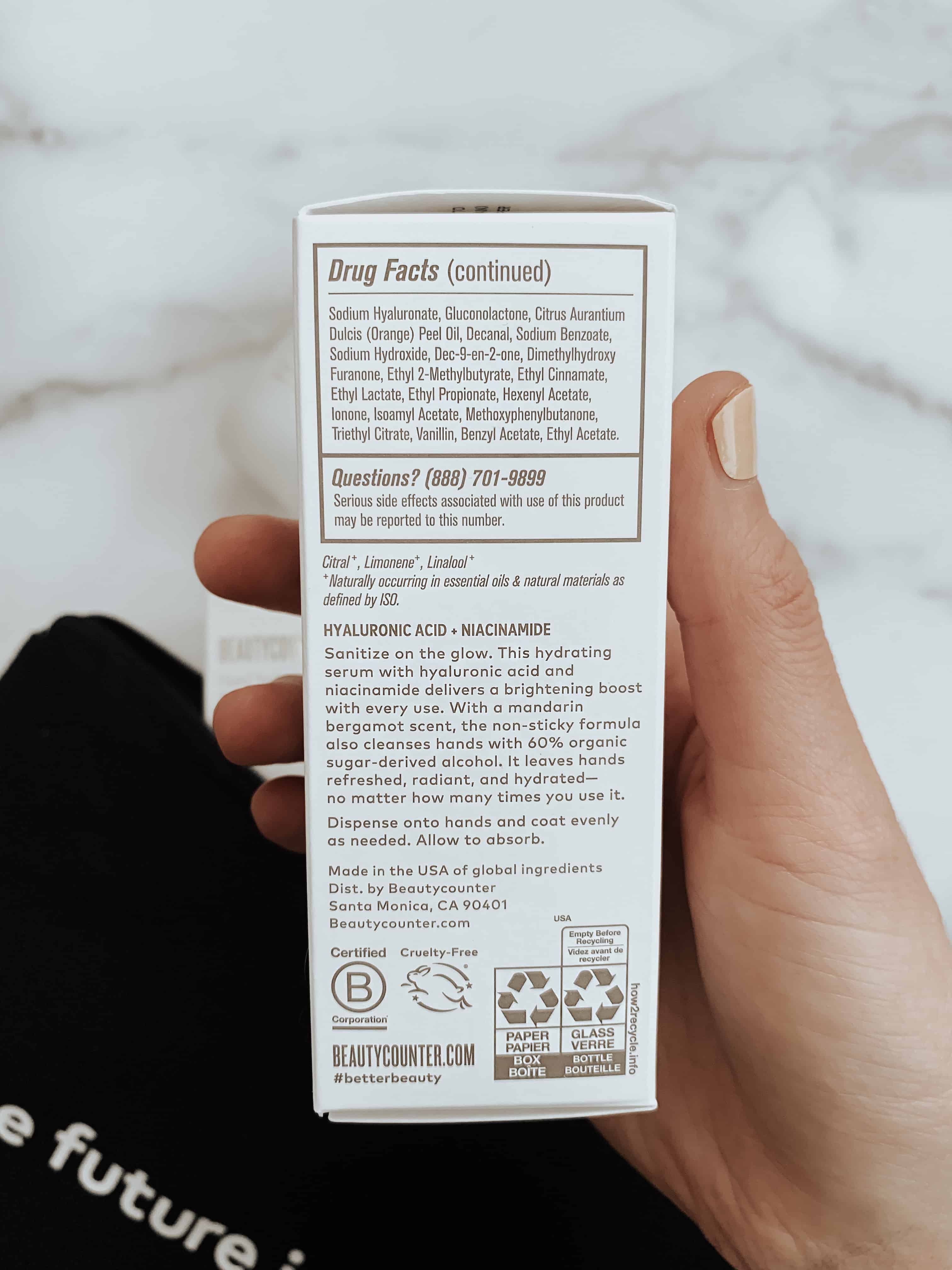 A hand holding up the new Hand Savior product packaging.