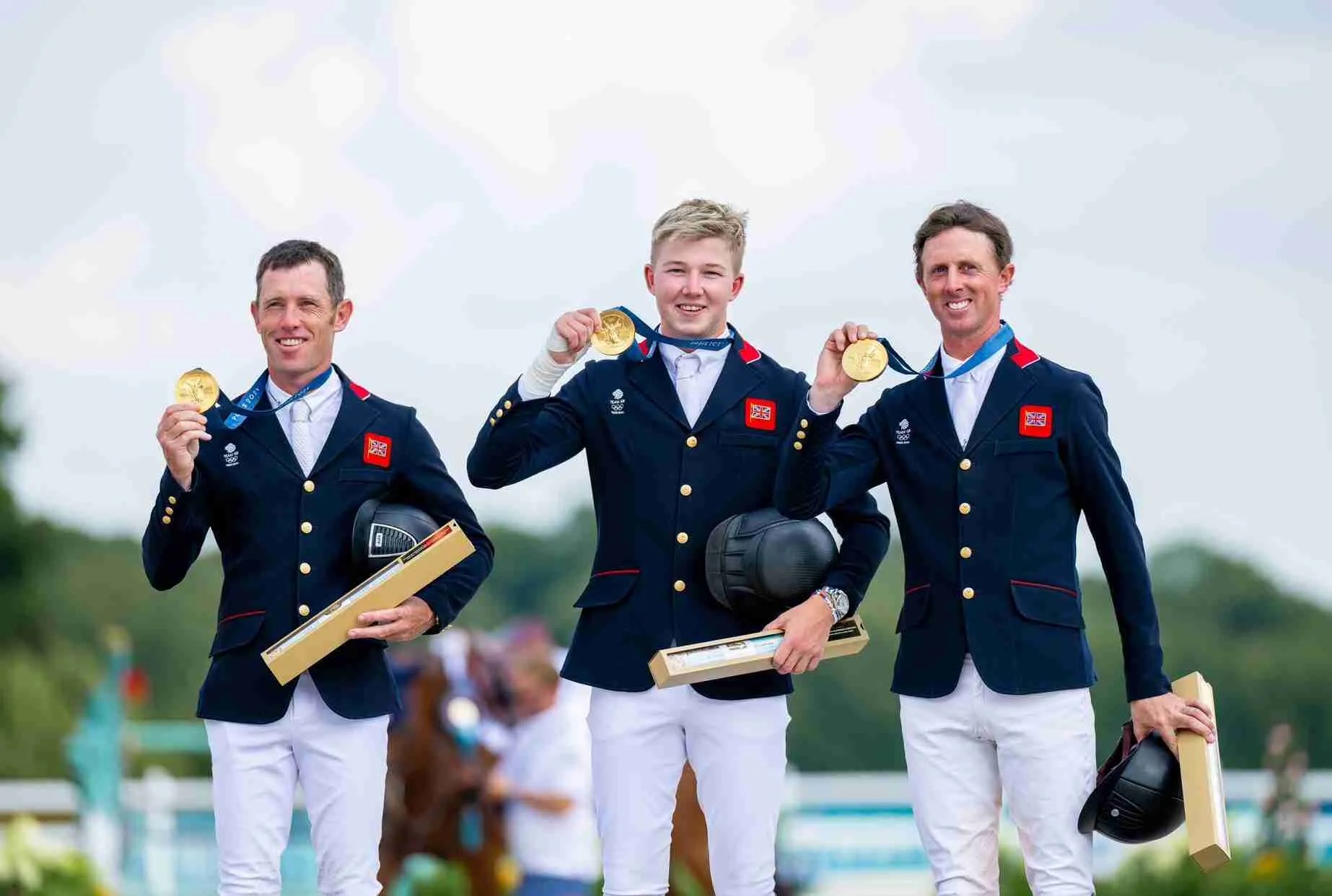Harry Charles, Ben Maher and Scott Brash holding gold medals