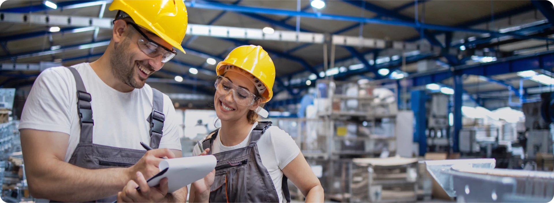 two manufacturing employees working in a facility