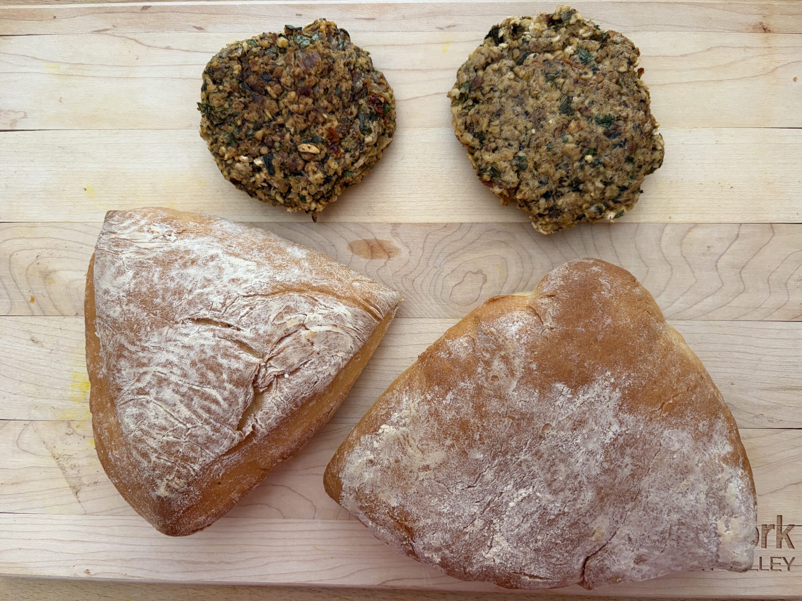 Photo of two homemade hamburger buns and veggie burgers