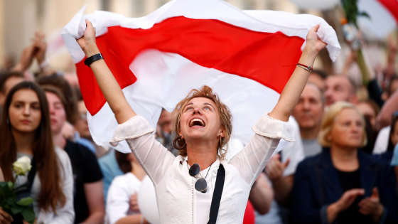 A woman waving a Belarus flag