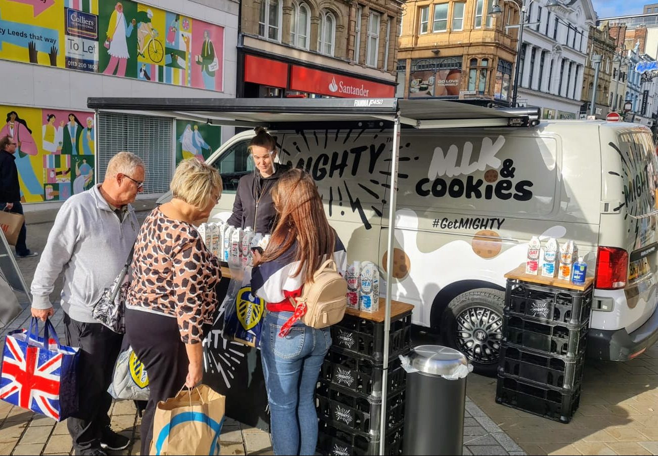 Executional roadshow team running a branded sampling stop on a UK tour