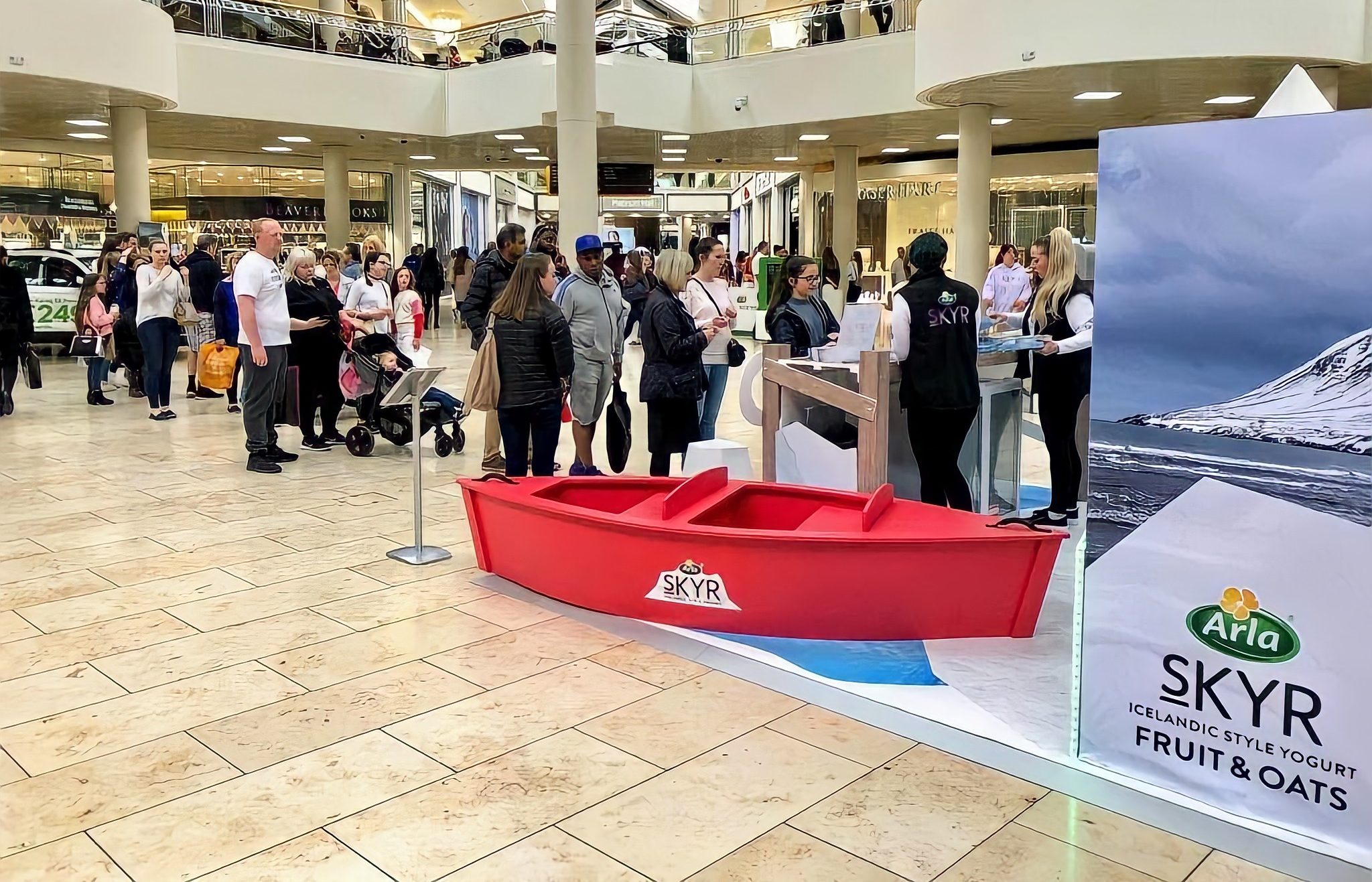 Executional team sampling to shoppers inside a UK shopping centre