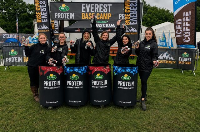 Arla Protein sampling staff at a Tough Mudder event basecamp