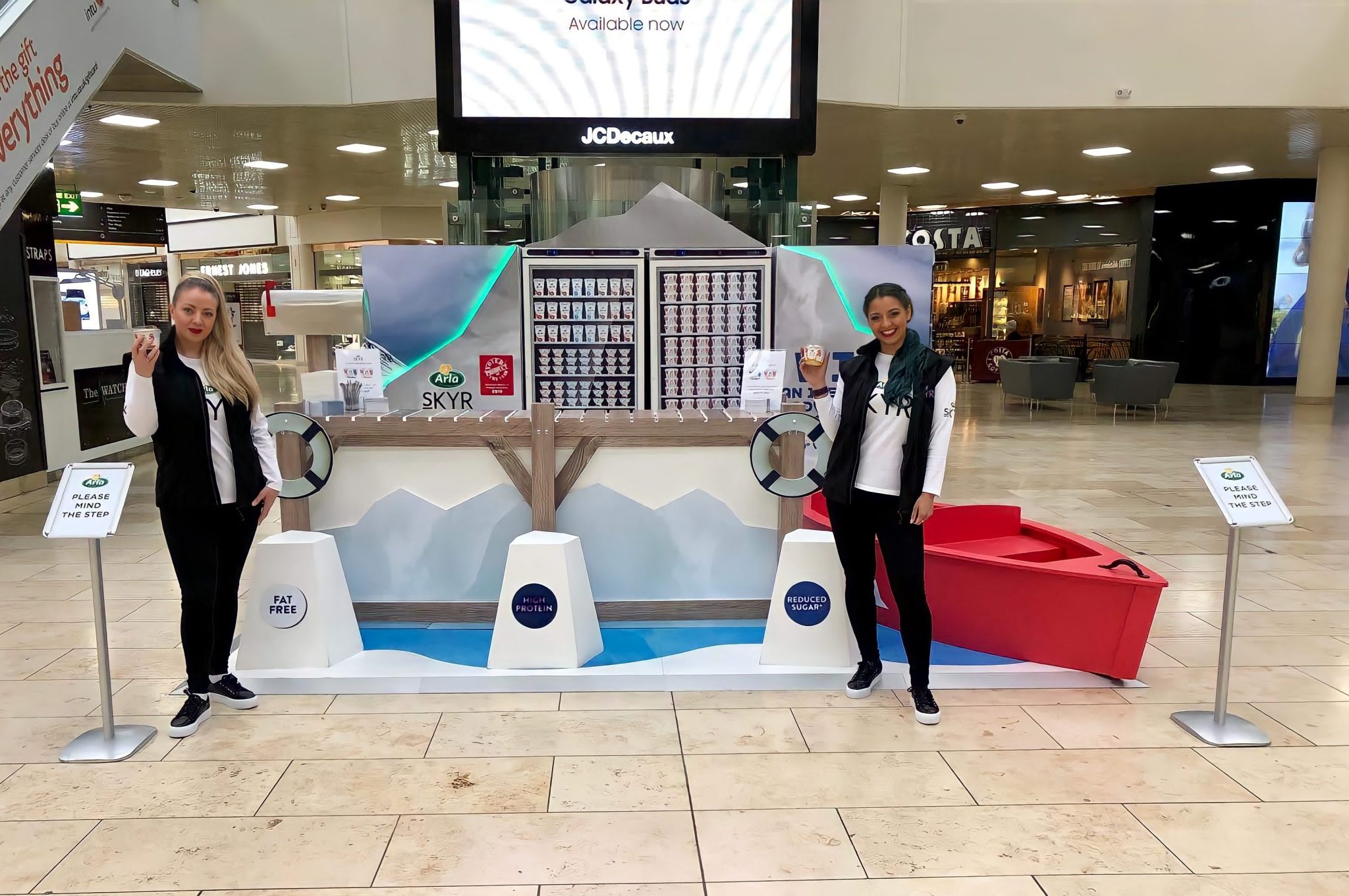 Executional team handing out product to shoppers