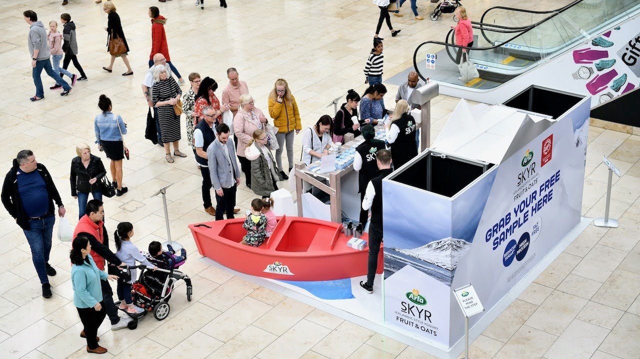 Executional shopping centre brand activation team working a Skyr stand
