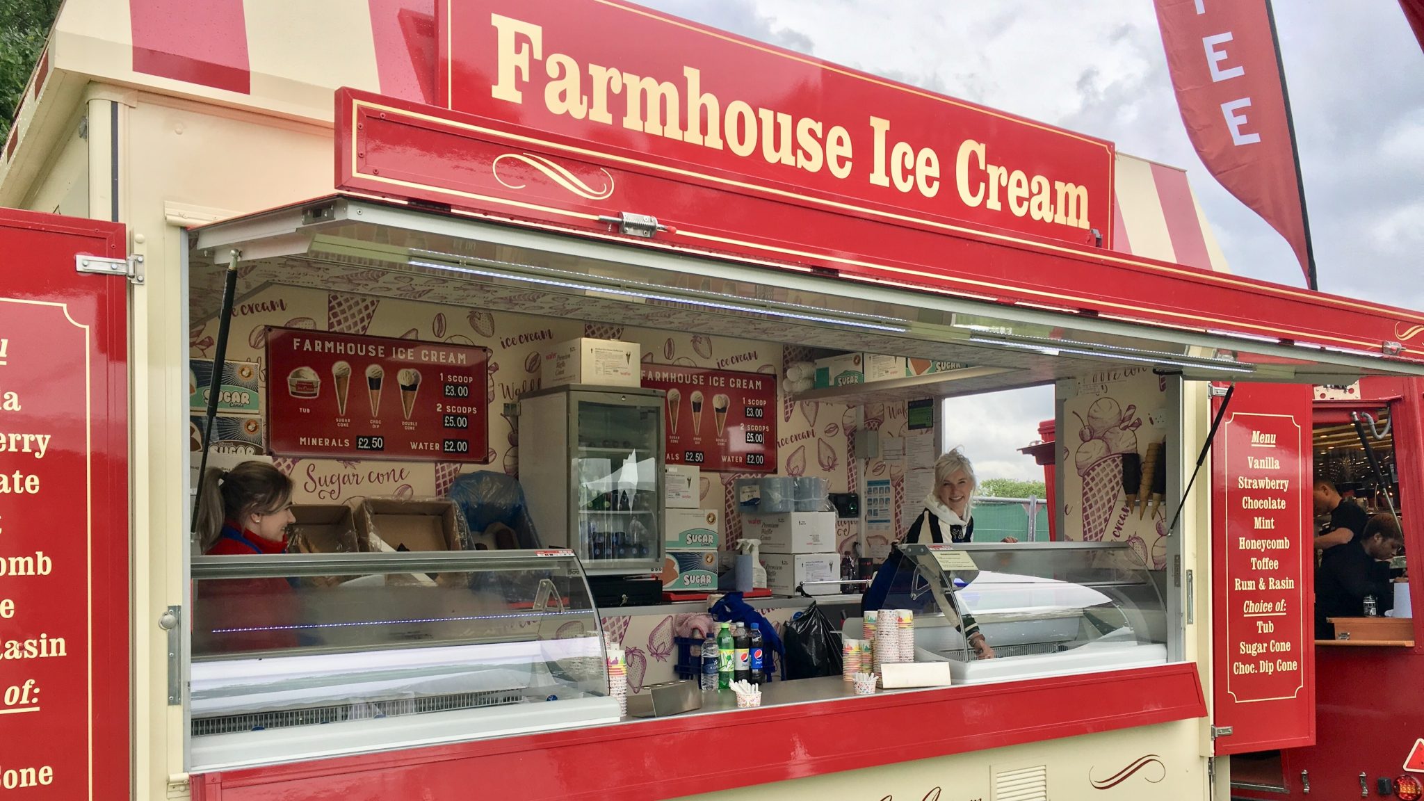 Executional staff working a Farmhouse ice cream trailer at a county show