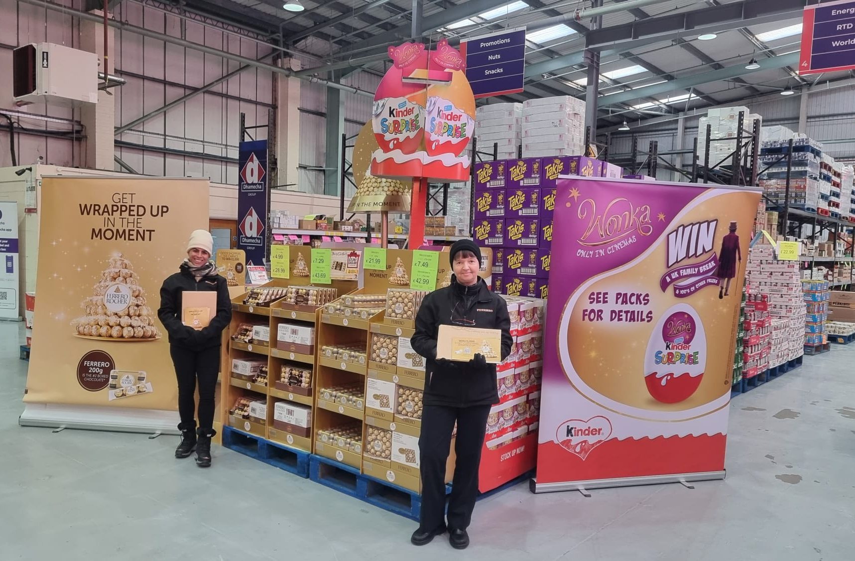 Executional merchandisers beside a Kinder display on a retail shop floor