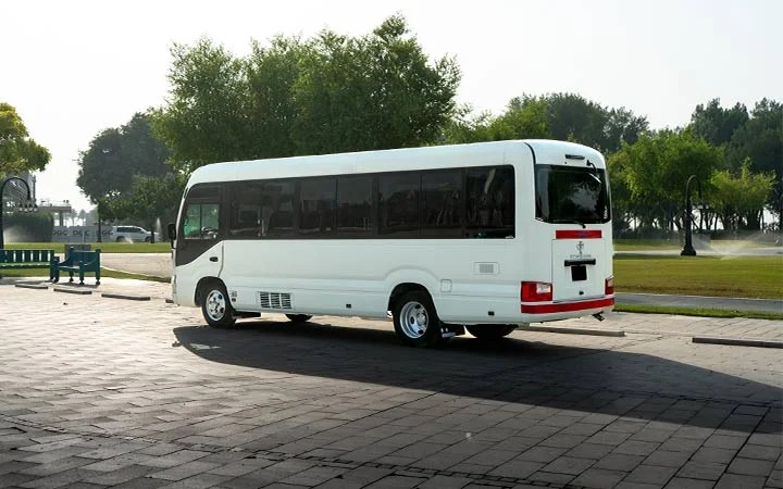 Rear exterior of Coaster bus for group transport in Doha Qatar