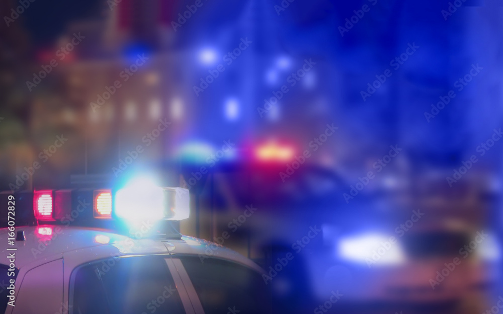 out of focus image suggesting police sirens and cars