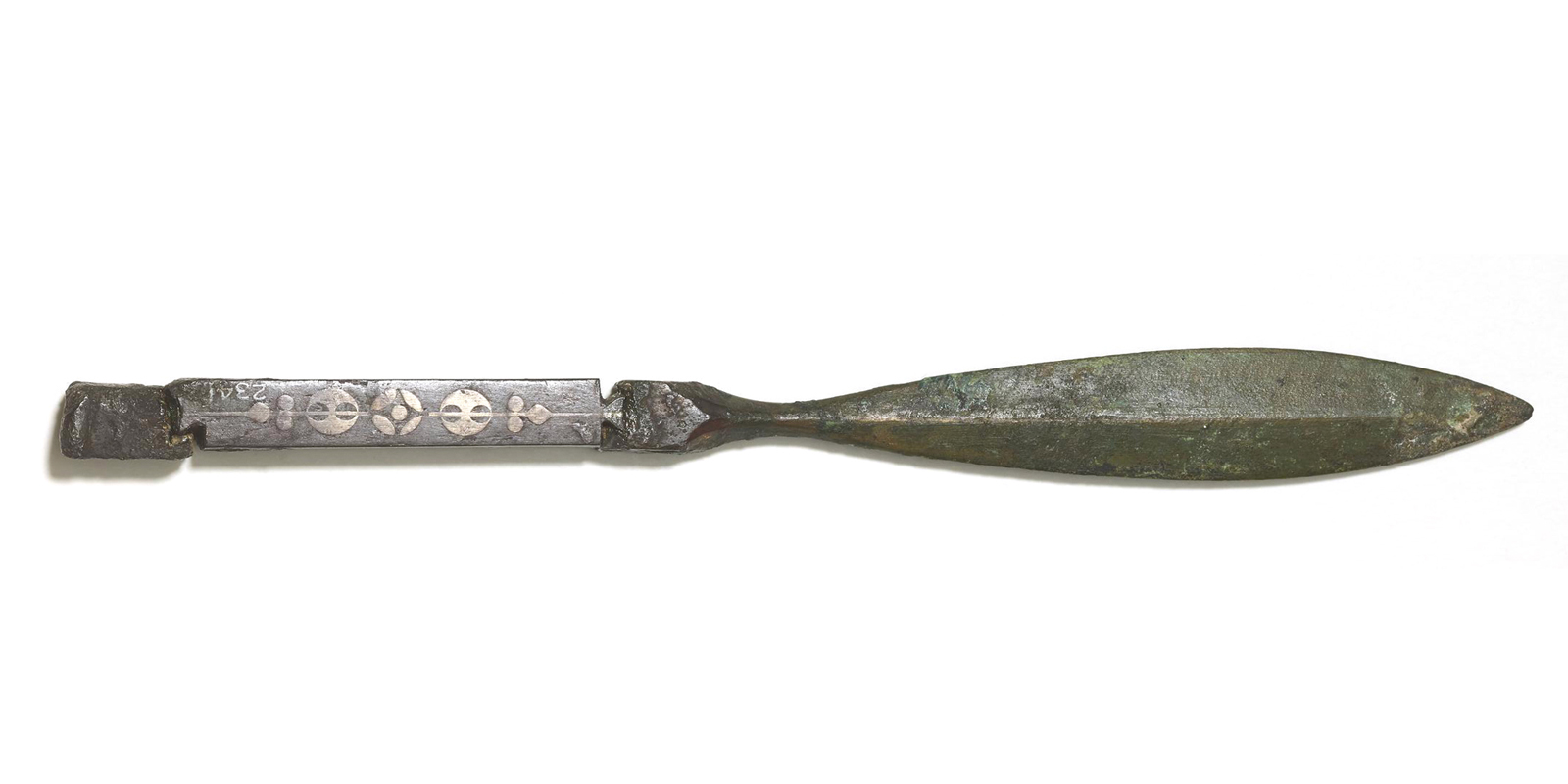 A thin, dark gray knife with a cylindrical handle and a flat, leaf-shaped blade. 