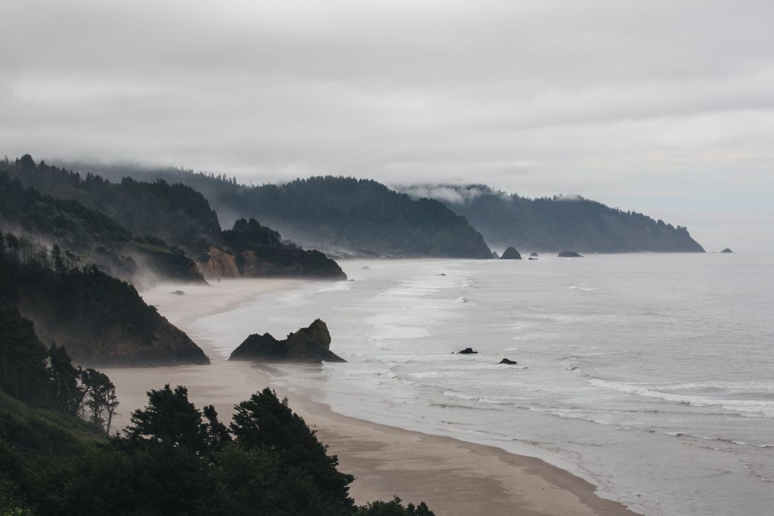 Oregon Coast with mountains and sandy beachs