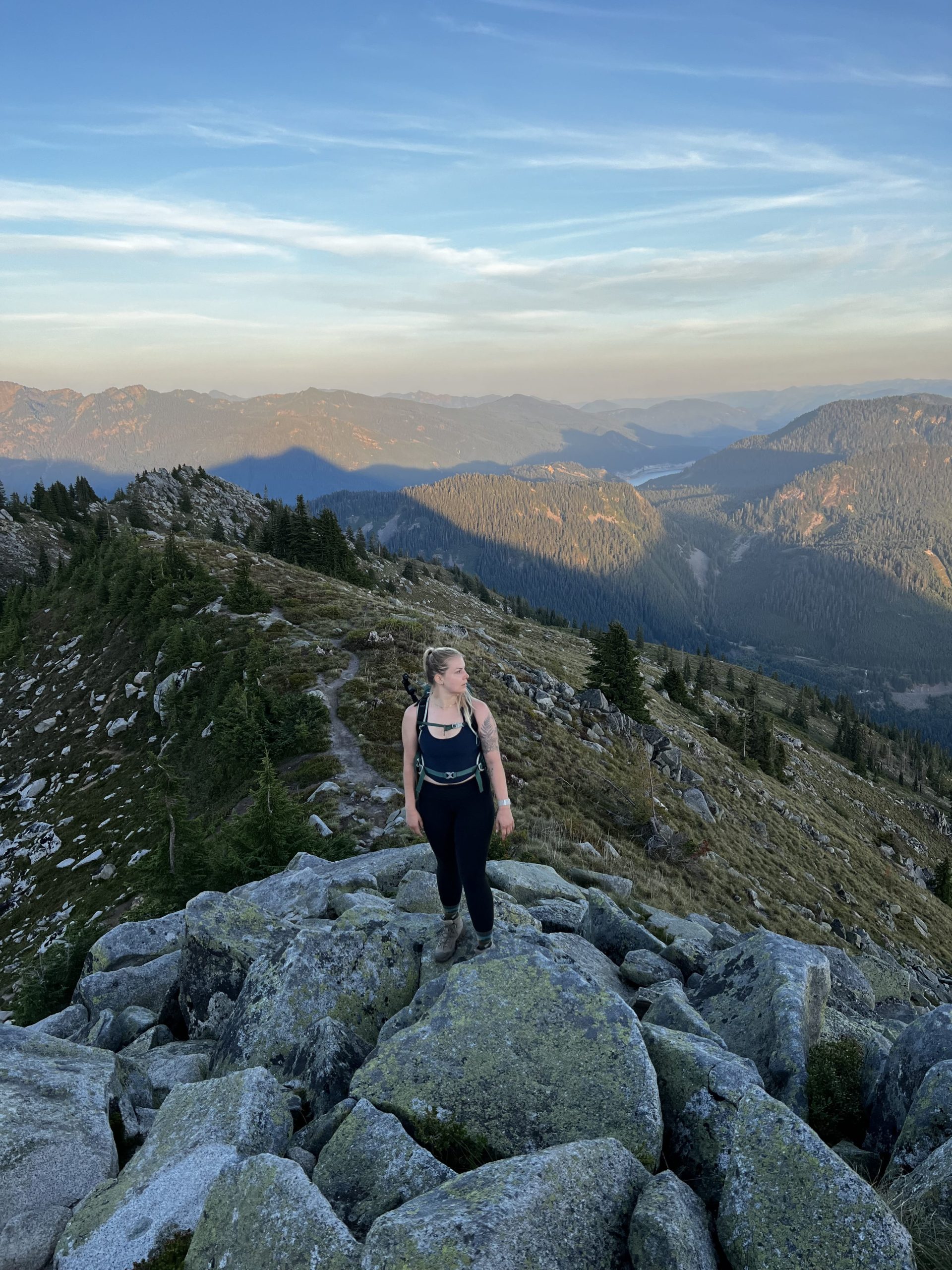 Female hiker standing on a pile of rocks
