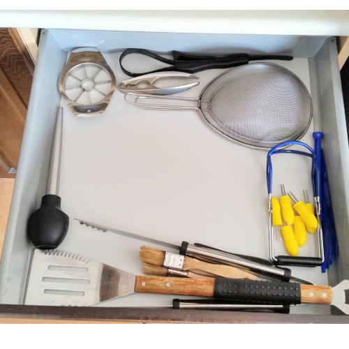 Kitchen drawer after it was successfully decluttered using these 6 decluttering tips.
