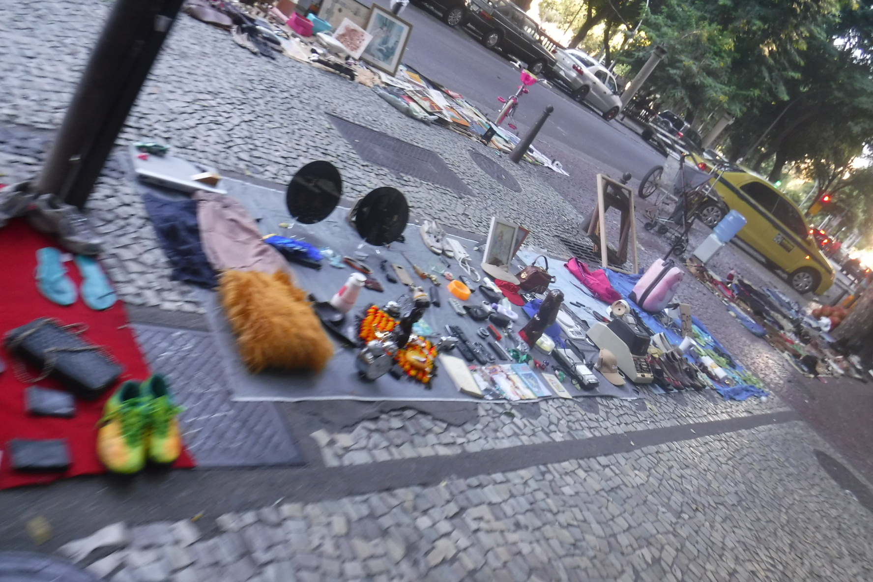 Random items for sale on blanket on streets of Rio de Janeiro.