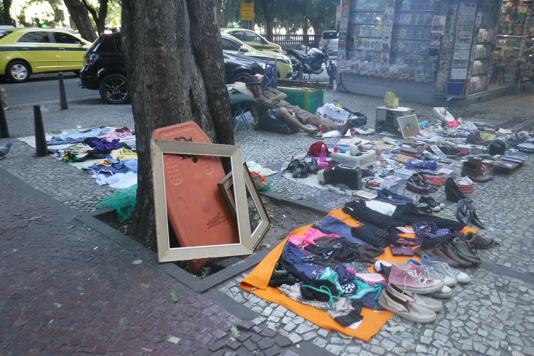 Random items for sale on blanket on streets of Rio de Janeiro.