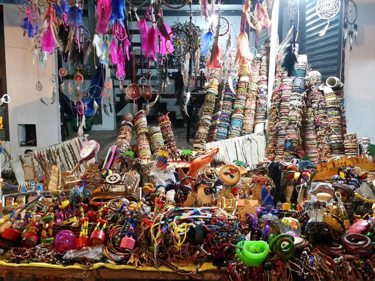 Colorful string and leather tourist bracelets for sale in Montañita.