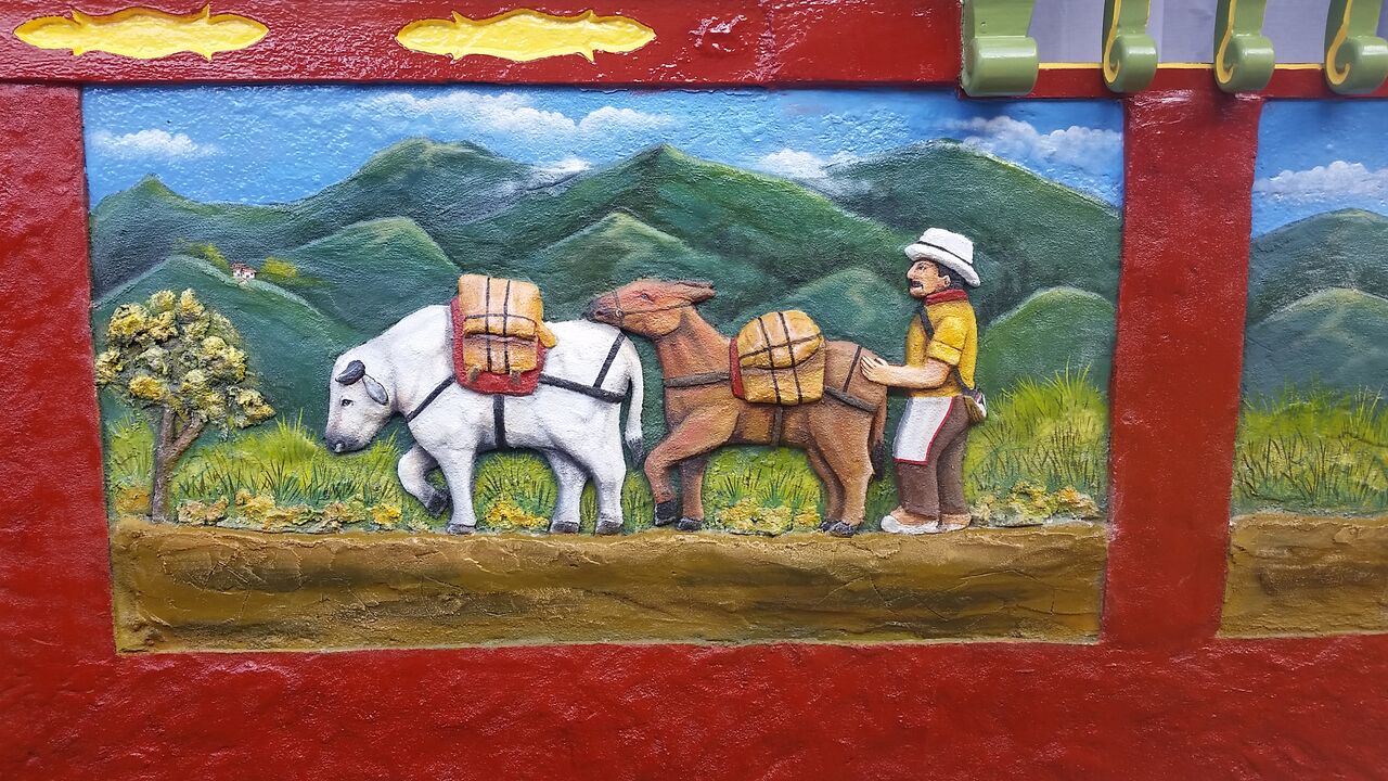 Man and horse image on a zocalo in Guatapé Colombia.