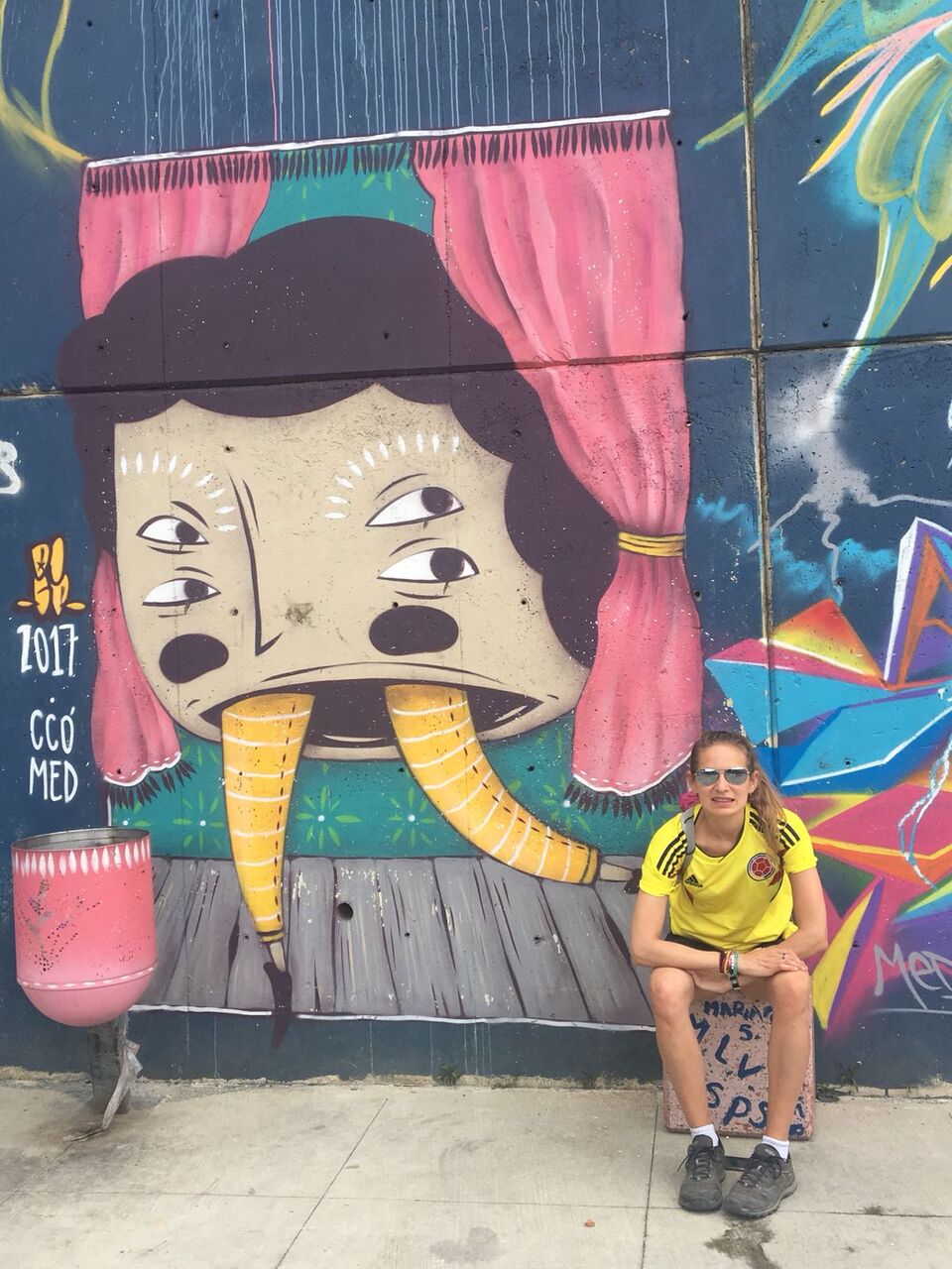 Posing with graffiti in Comuna 13
