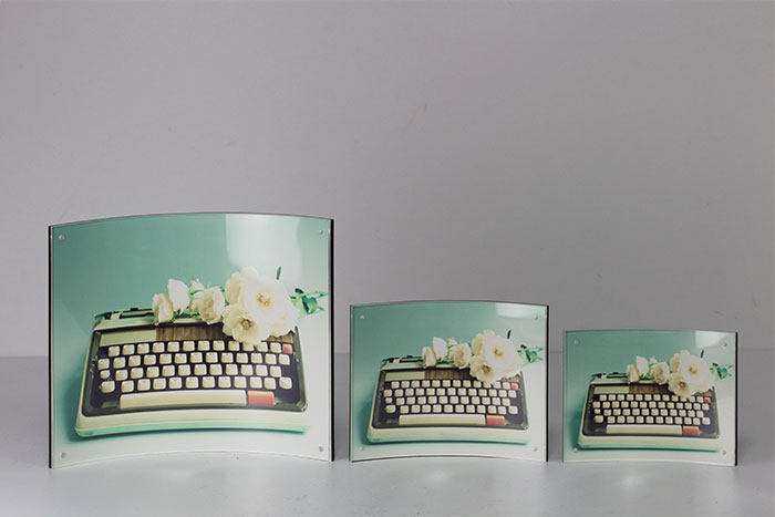 The Clear Curved Acrylic-Plexi Glass Counter Card holds high definition paper in place with magnetic corners.