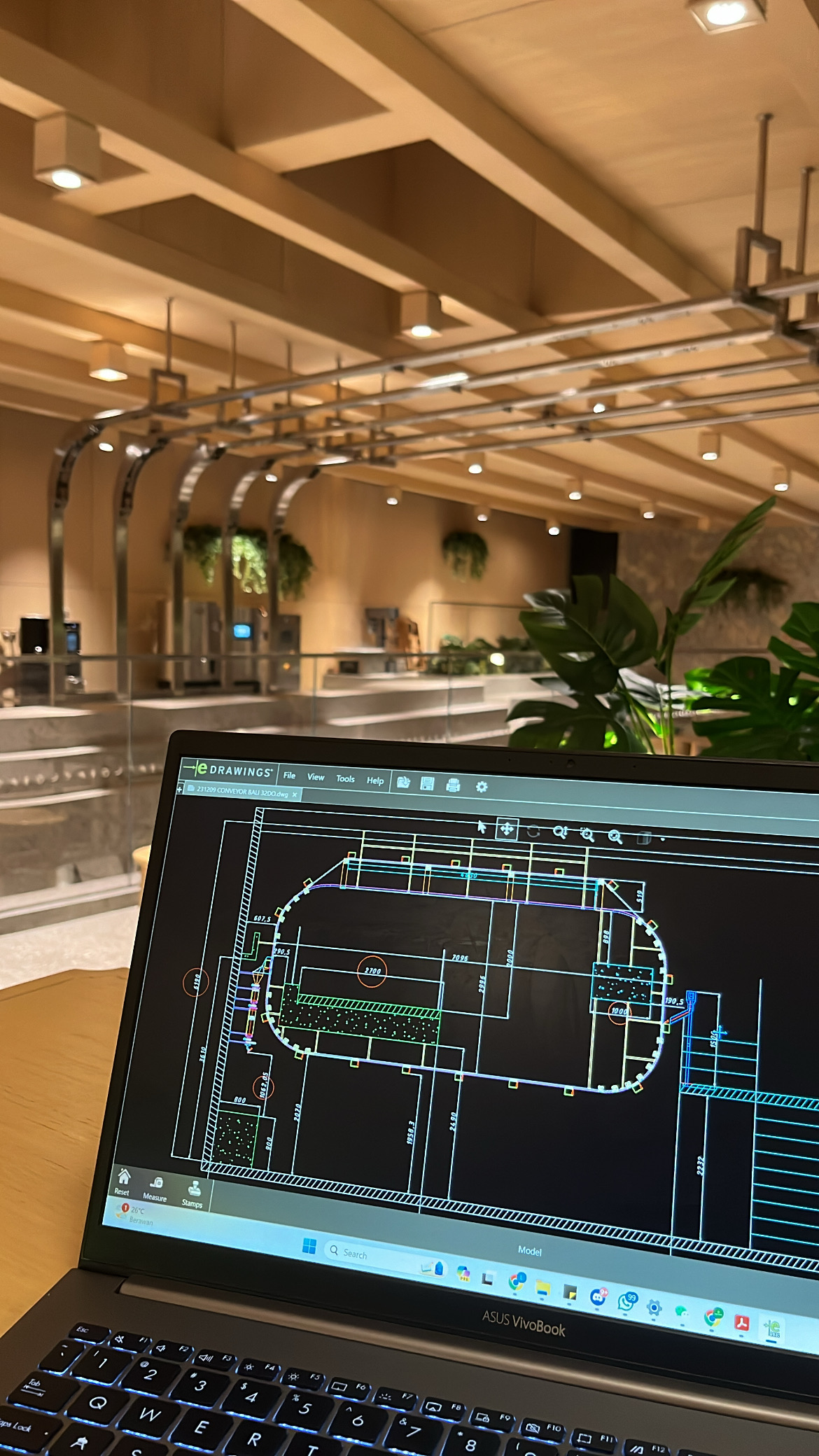 32DO Coffee Rail engineering drawing reviewed beside the installed overhead rail