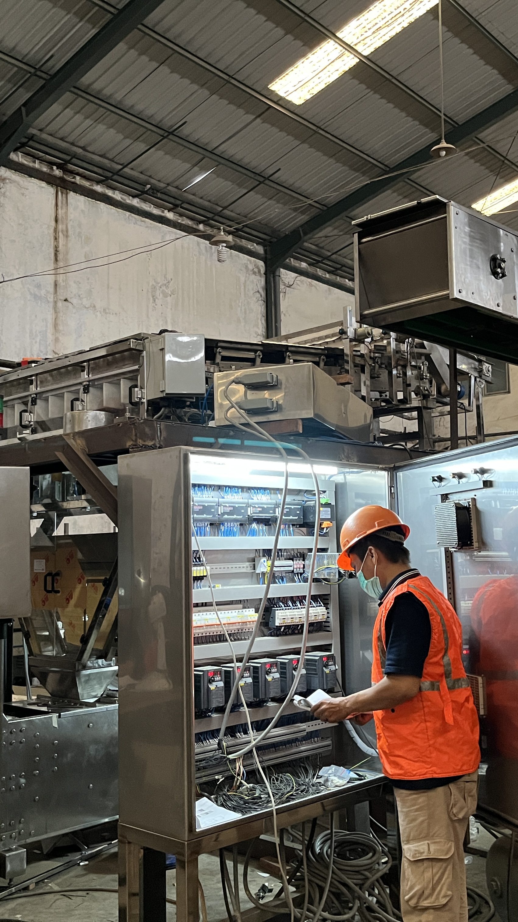FABA Tech technician working on industrial automation equipment