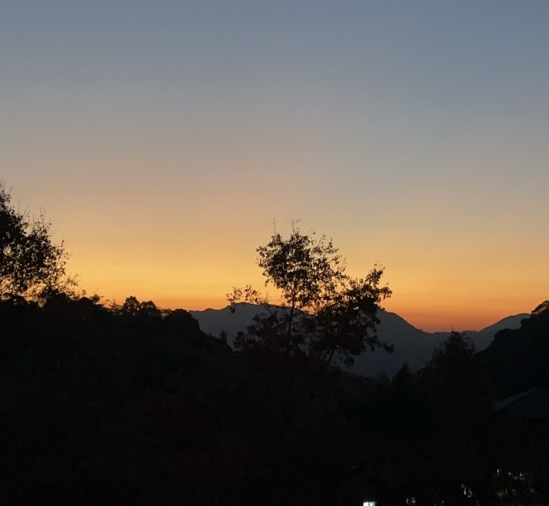 Sun about to rise over the mountains.