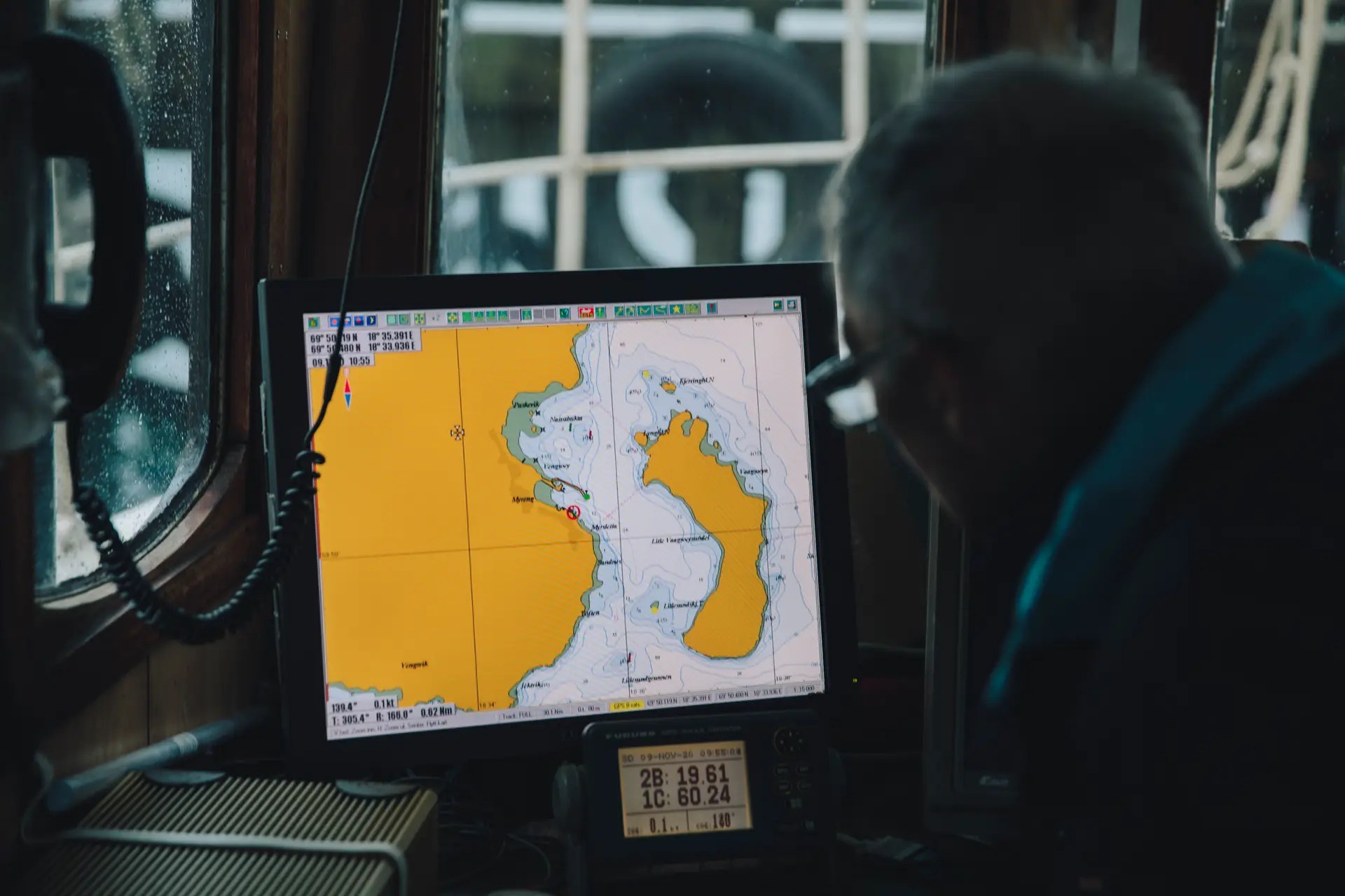 Man looking at map on a computer screen.
