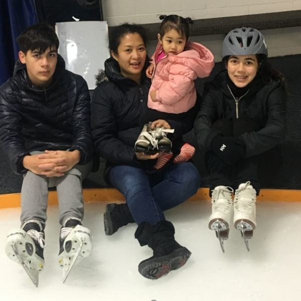 Benjamin and Lucy teaching Danielle how to skate.