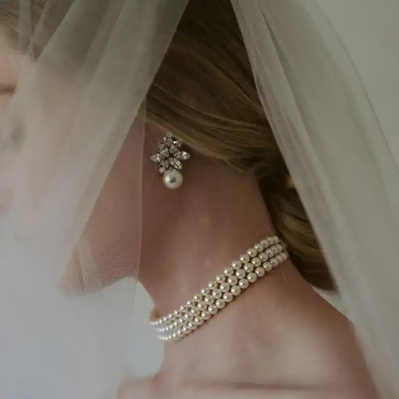 jennifer behr crystal and pearl liza earrings shown on bridal model