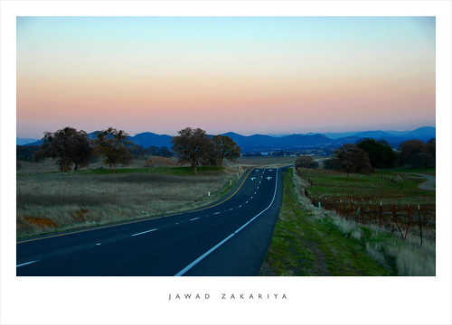Photo: California Route 120 on a beautiful cloudless day with the sun just having gone down in the opposite direction leaving a nice pink hue in its wake. Photo by Jawad Zakariya.