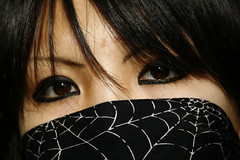Woman with a spider web scarf on the face, Harajuku, Tokyo, Japan
