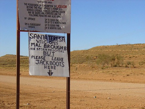 Santa Teresa township sign - Leave jackboots here