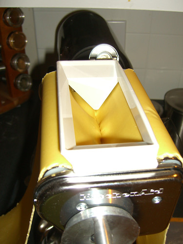 Putting the dough in the ravioli maker
