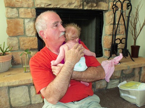 my daddy holding my baby.