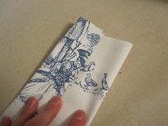 Fold edges to middle