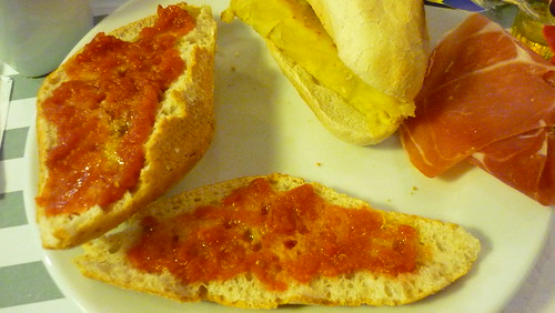 Spread the grated tomato on bread