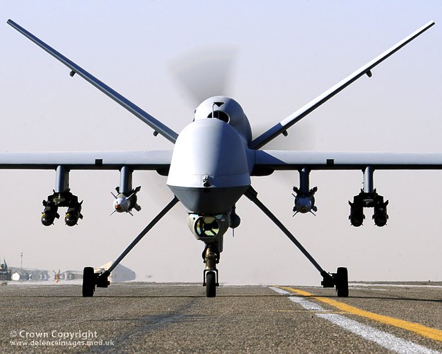 An armed British Reaper UAV taxis on the runway at Kandahar Airfield in Afghanistan.
