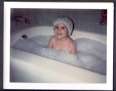 I've always gotten good ideas in the bath. Four year old me in a bubble bath wearing a shower cap.