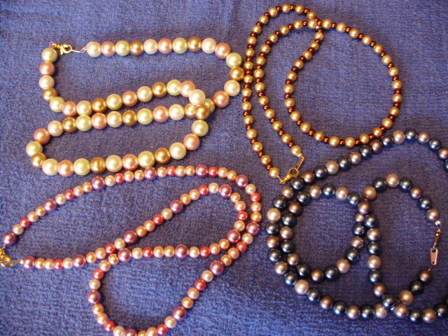 Glass Pearls made into different necklaces of different colors pink, cream, blue, grey