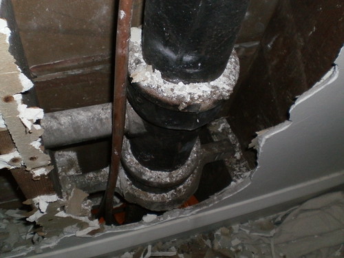 View of the offending pipe from the hole in my bedroom wall