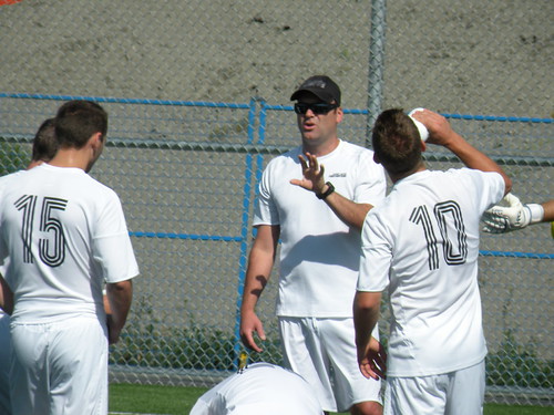 Niall Thompson, former Vancouver Whitecaps and Canadian international striker, gives Surrey their team talk prior to the match.