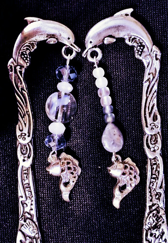 Two metal book marks with beads to dangle outside the book