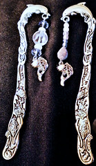 Metal dolphin bookmarks with beads.