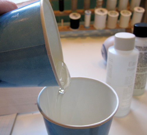 Pouring resin to second container