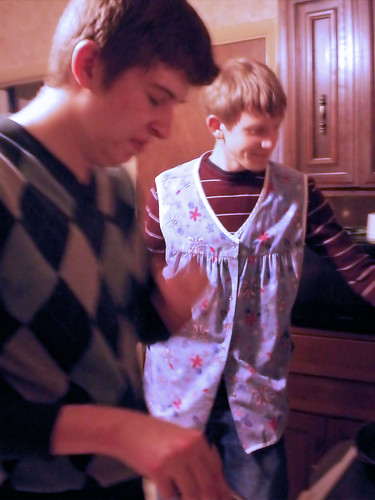 Adam wears one of my aprons and Aaron makes an odd face