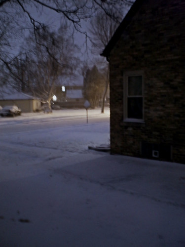 Snow scene in neighborhood at night Bad picture of bad weather