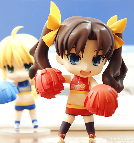 Tohsaka Rin is carrying red pompoms