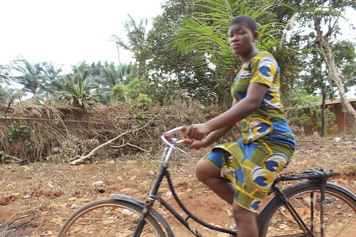 Iheaka Village Female Bicyclist by Jujufilms
