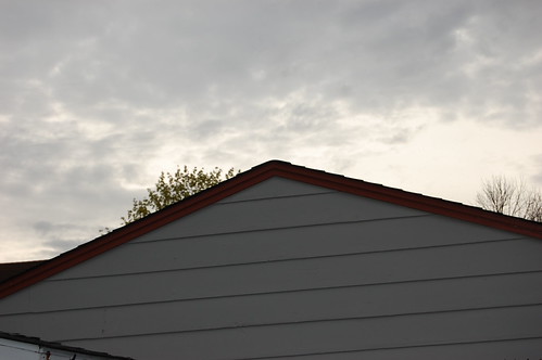 roof line of neighbor's garage against evening sky